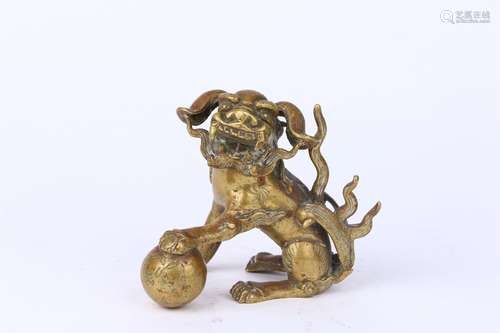 Gilt Copper Ornament of a Lion Frolicking with a  Ball