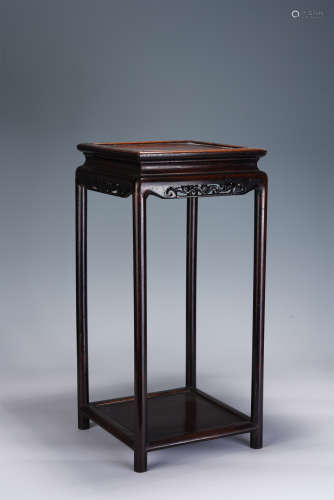 A CHINESE CARVED HARDWOOD SQUARE TABLE