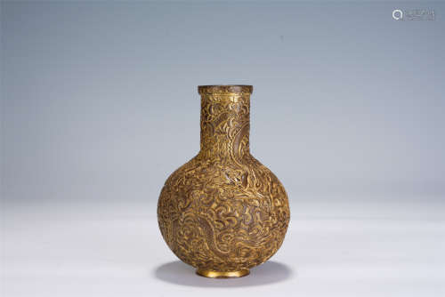 A CHINESE GILT BRONZE VASE WITH CARVED DRAGONS
