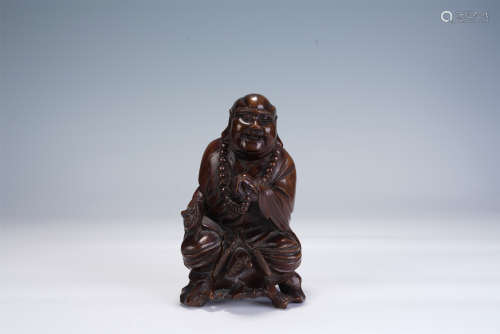 A CHINESE HARDWOOD CARVING OF LUOHAN
