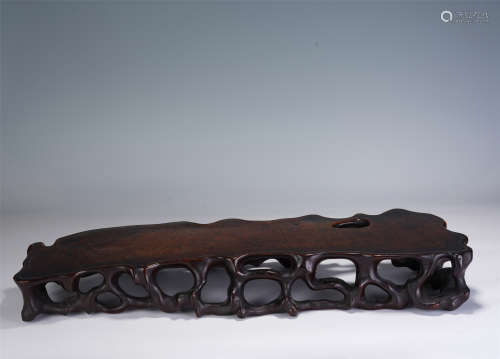 A CHINESE CARVED FREE-FORM HARDWOOD TABLE