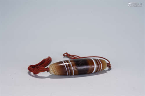 A CHINESE CARVED AGATE DZI BEAD