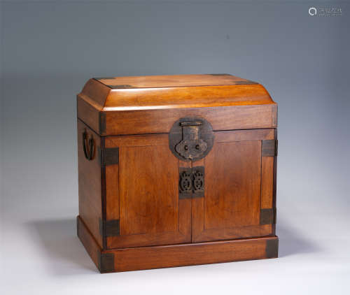 A CHINESE CARVED HARDWOOD LIDDED CABINET