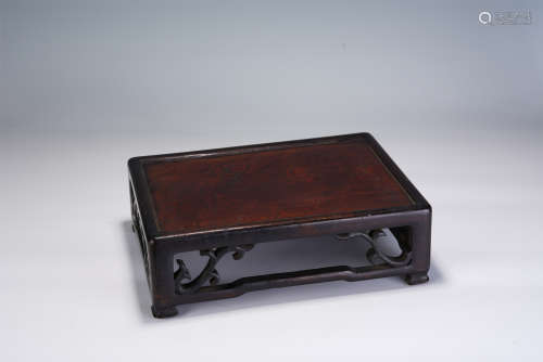 A CHINESE CARVED HARDWOOD RECTANGULAR TABLE