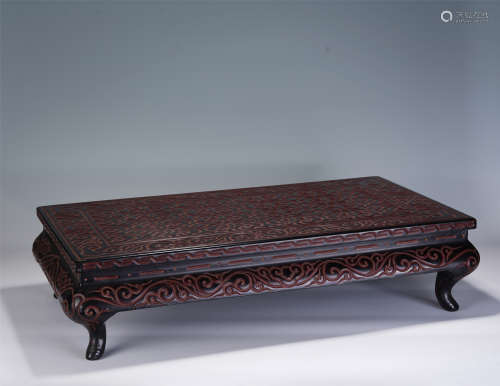 A CHINESE CARVED LAQUER RECTANGULAR TABLE