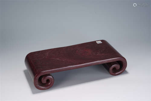 A CHINESE COILED-FOOTED HARDWOOD TABLE