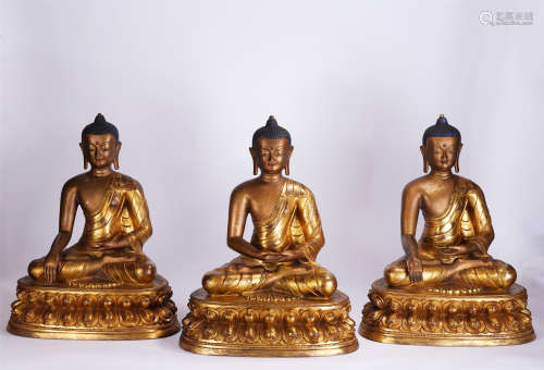 A GROUP OF THREE CHINESE GILT BRONZE FIGURE OF BUDDHA