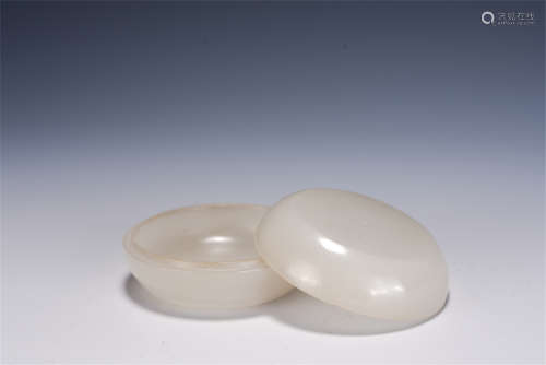 A CHINESE CARVED WHITE JADE ROUND BOX WITH COVER