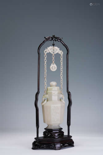 A CHINESE CARVED WHITE JADE HANGING VASE