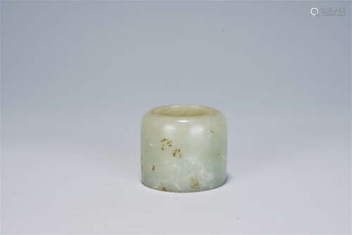 A CHINESE CARVED JADE THUMB RING