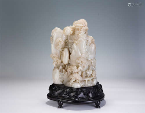 A CHINESE WHITE JADE CARVING OF LANDSCAPE AND FIGURES