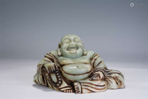A CHINESE CARVED PORCELAIN FIGURE OF BUDDHA