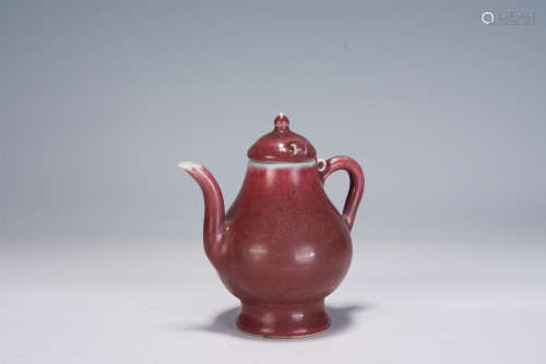 A CHINESE RED GLAZED PORCELAIN EWER