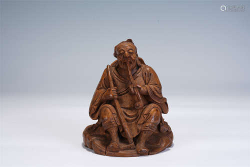 A CHINESE BAMBOO CARVING OF SITTING FIGURE