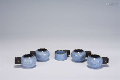A GROUP OF FIVE CHINESE GLAZED PORCELAIN BIRD FEEDER JARS