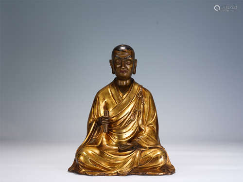 A CHINESE GILT BRONZE FIGURE OF SITTING BUDDHA