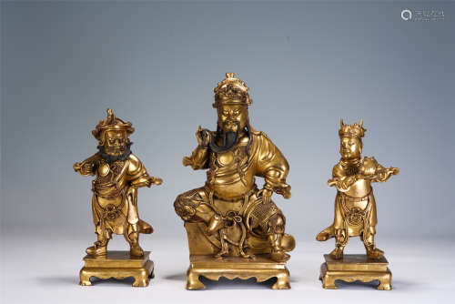 A GROUP OF THREE CHINESE GILT BROZNE FIGURES OF GUANGONG