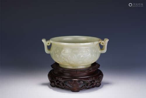 A CHINESE CARVED DOUBLE HANDLE WHITE JADE CUP