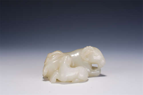 A CHINESE CARVED WHITE JADE DECORATION OF MYTHICAL ANIMALS