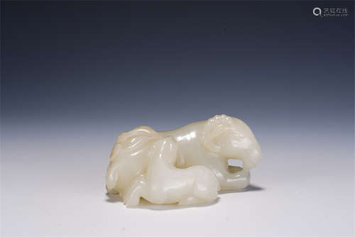 A CHINESE CARVED WHITE JADE DECORATION OF MYTHICAL ANIMALS