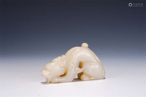 A CHINESE CARVED WHITE JADE DECORATION OF MYTHICAL ANIMAL