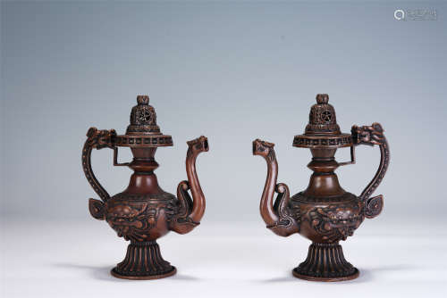 A PAIR OF CHINESE CARVED BRONZE EWERS