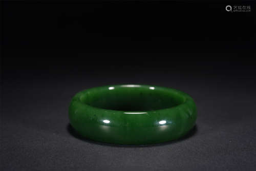 A CHINESE CARVED JASPER BANGLE