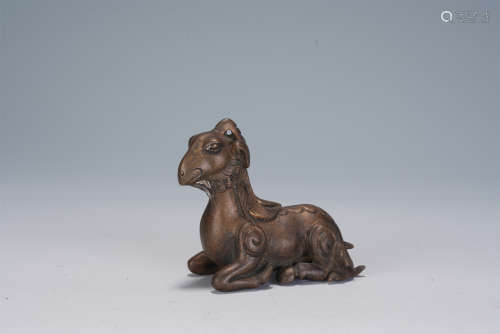 A CHINESE CARVED SHEEP-SHAPED BRONZE PAPERWEIGHT
