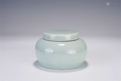 A CHINESE CELADON GLAZED PORCELAIN JAR WITH COVER