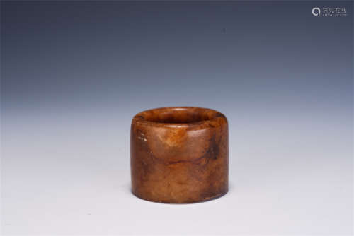 A CHINESE CARVED JADE THUMB RING