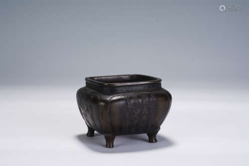 A CHINESE CARVED FOUR-FOOTED BRONZE INCENSE BURNER