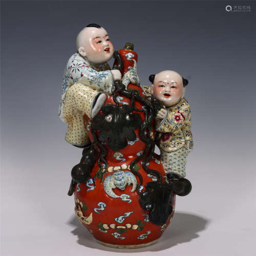 A CHINESE FAMILLE ROSE DOUBLE GOURD AND BOYS SHAPED PORCELAIN BOTTLE DECORATION