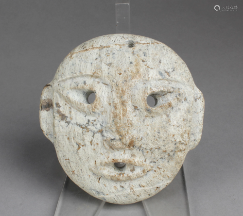 A Carved Jadestone Face Mask