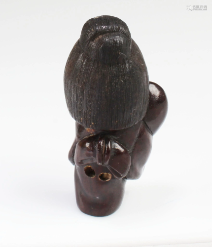 A Carved Wooden Figurine