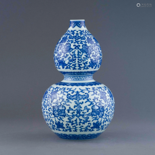 QIANLONG BLUE & WHITE WRAPPED FLORAL DOUBLE GOURD …