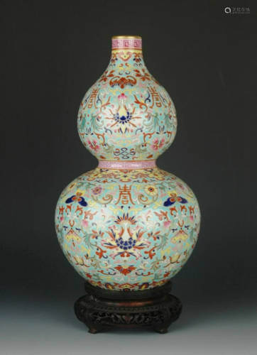 A FAMILLE ROSE DRAGONS DOUBLE GOURD VASE