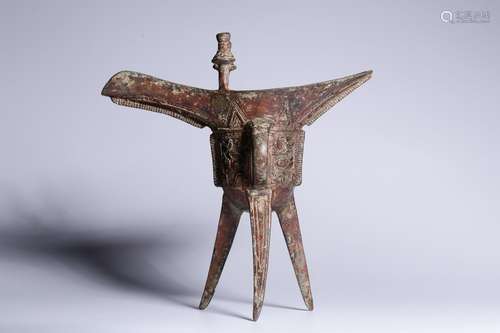 ARCHAIC BRONZE CAST 'TAOTIE' TRIPOD RITUAL WINE CUP, JUE