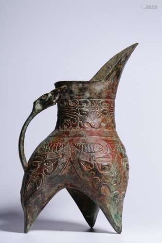 ARCHAIC BRONZE CAST 'TAOTIE' TRIPOD RITUAL VESSEL WITH HANDLE