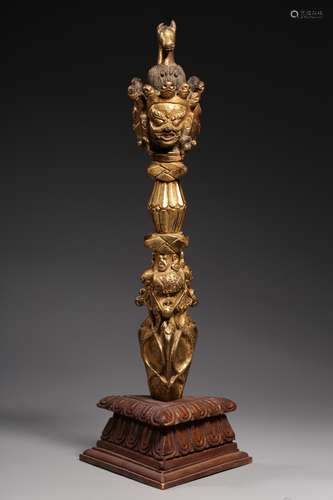 GILT BRONZE CAST 'VAJRA' RITUAL IMPLEMENT WITH WOODEN STAND