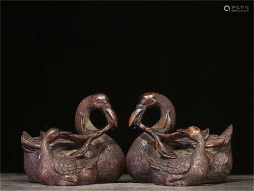 A Pair of Chinese Carved Hardwood Decorations