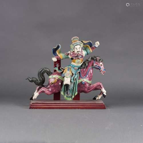 A JIAOZHI-GLAZED PORCELAIN FIGURE OF A MALE RIDING ON A HORSE