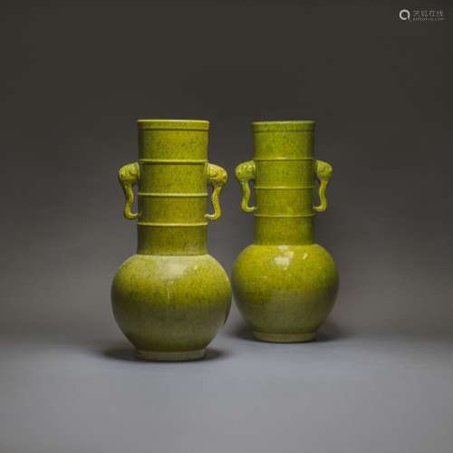 A PAIR OF LIME-GREEN GLAZED VASES