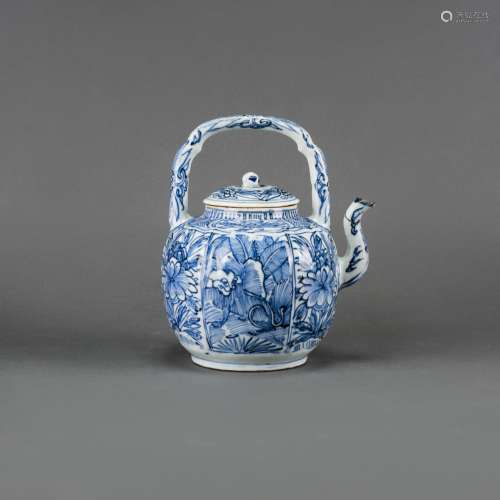 A BLUE AND WHITE TEAPOT AND COVER