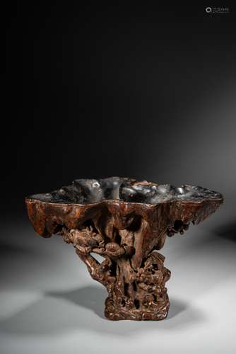 A CHINESE ALOESWOOD CARVED 'LANDSCAPE' LIBATION CUP