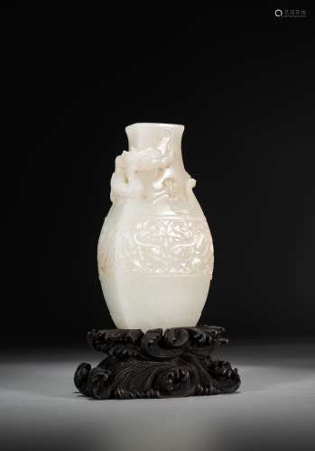 A WHITE JADE CARVED 'DRAGON & TAOTIE' VASE WITH STAND