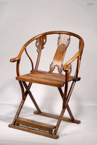 A HUANGHUALI FOLDING ARMCHAIR