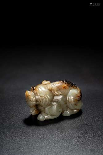 A CHINESE CELADON AND BLACK JADE MYTHICAL BEAST