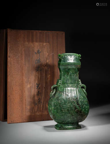 A LARGE CHINESE SPINACH GREEN JADE 'TAOTIE' HU VASE