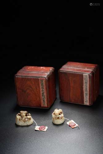 A PAIR OF ARCHAIC WHITE JADE SEALS WITH HUANGHUALI BOXES