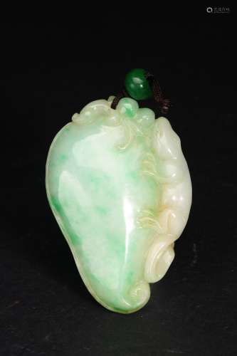 A JADEITE CARVED MYTHICAL BEAST PENDANT